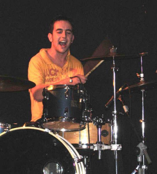 Tutor playing guitar